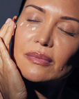 Woman applying Synergie Skin ImprovEyes Night Eye Cream - overnight eye treatment for dark circles and puffiness