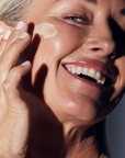 Mature woman using Synergie Skin ReClaim Moisturiser - anti-ageing moisturiser for firmer skin Australia