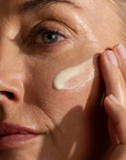Woman applying Synergie Skin Effica C Vitamin C Serum - brightening serum for collagen and pigmentation Australia