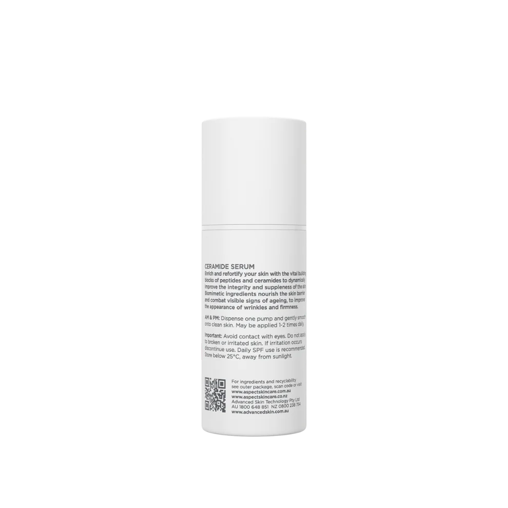 White skincare serum bottle with text on a white background