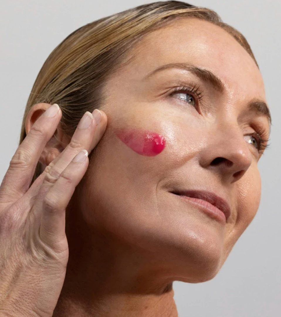 Woman applying Synergie Skin HyalaVive Hyaluronic Acid Serum - hydrating serum for plump and dewy skin Australia