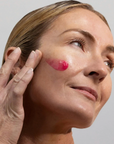 Woman applying Synergie Skin HyalaVive Hyaluronic Acid Serum - hydrating serum for plump and dewy skin Australia