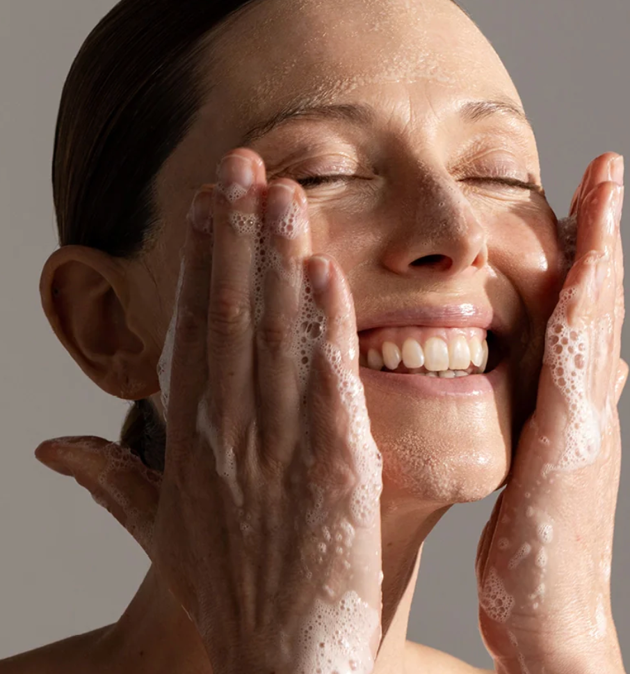 Woman cleansing with Synergie Skin Ultra Cleanse - gentle pH balanced cleanser for all skin types Australia