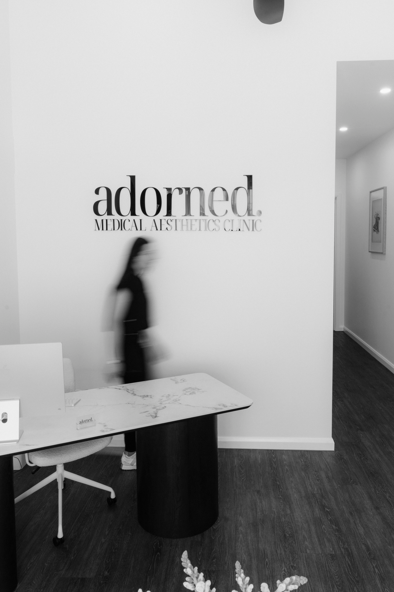 Nurse walking across clinic reception