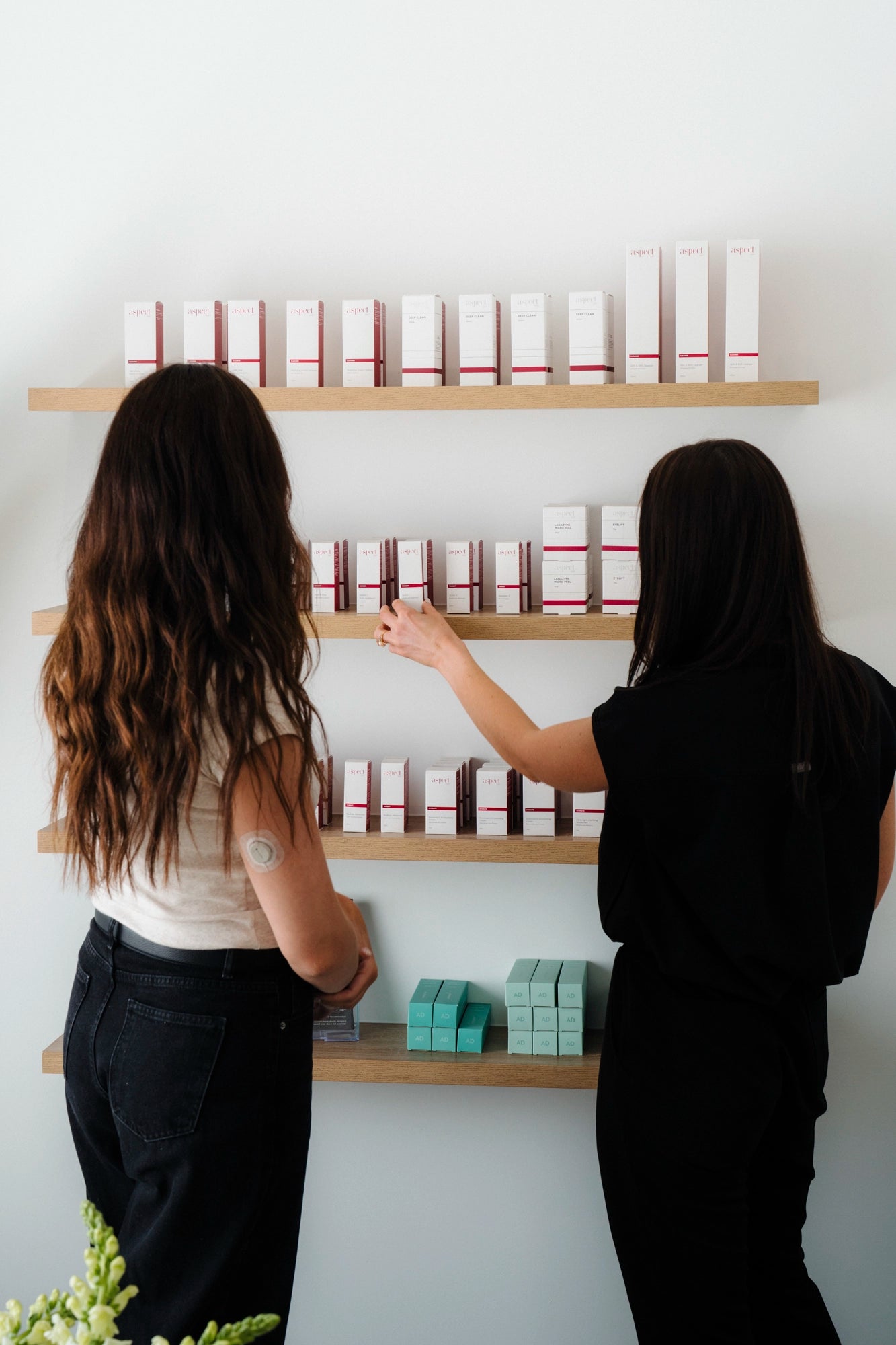 Aspect Dr and AiryDay skincare lineup on clinic shelf, Toowoomba