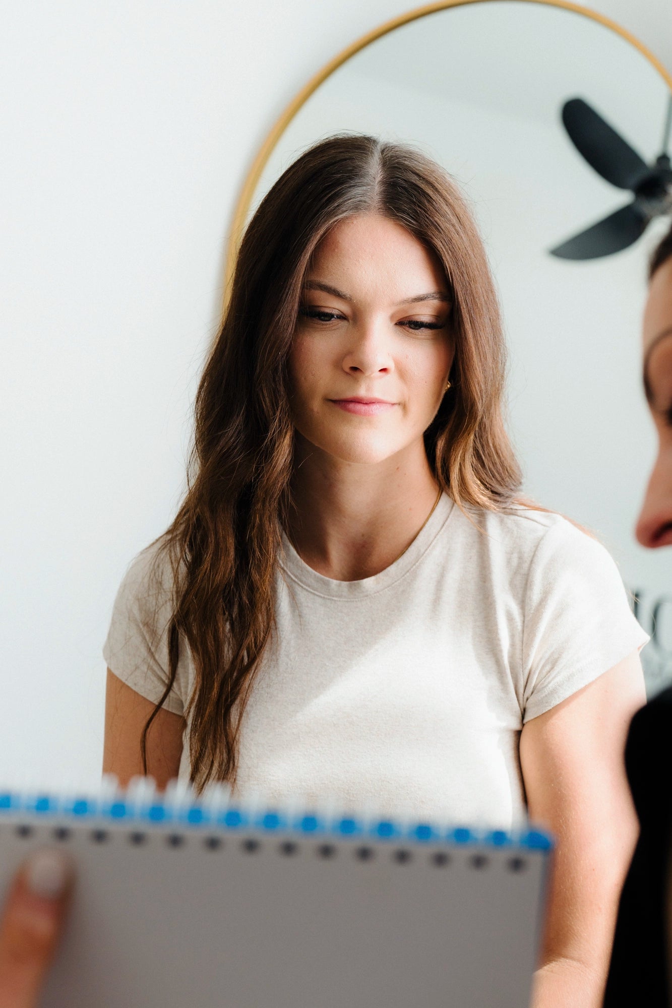 Woman holding a notebook with a blurred background